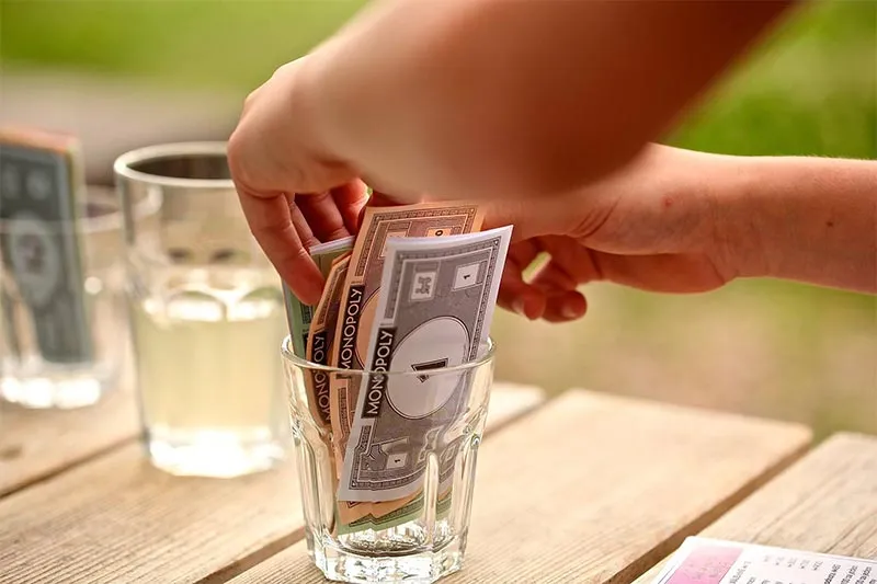 monopoly money in a jar